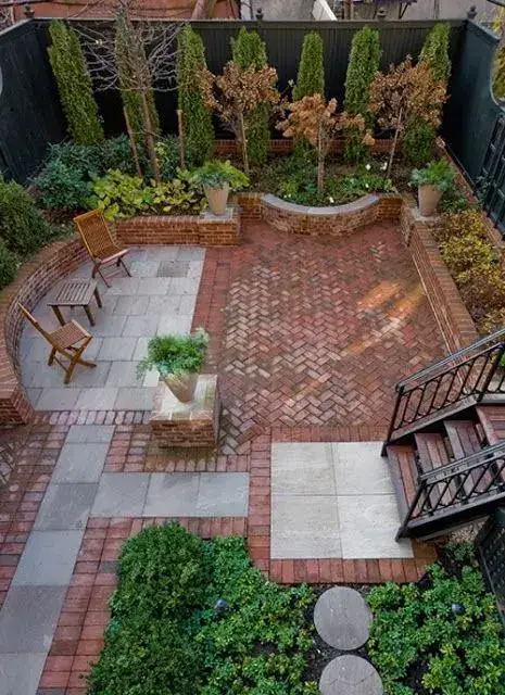 Herringbone brick and stone patio seen from above