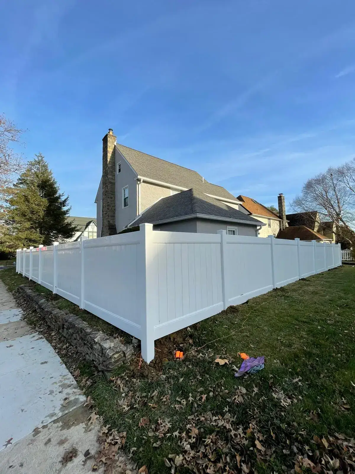 White vinyl privacy fence on a corner lot